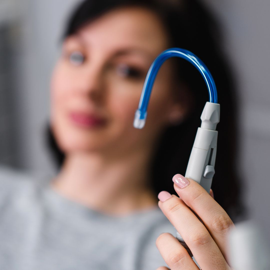 woman holding dental tube